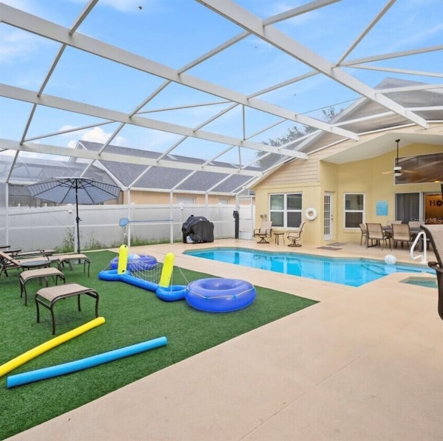 2567 Oneida Loop, Kissimmee, FL 34747 - view of swimming pool with fence, a patio area, a ceiling fan, a sink, and a lanai