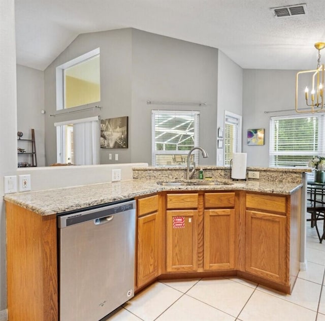 2567 Oneida Loop, Kissimmee, FL 34747 - kitchen with dishwasher, a sink, healthy amount of natural light, a chandelier, and high vaulted ceiling