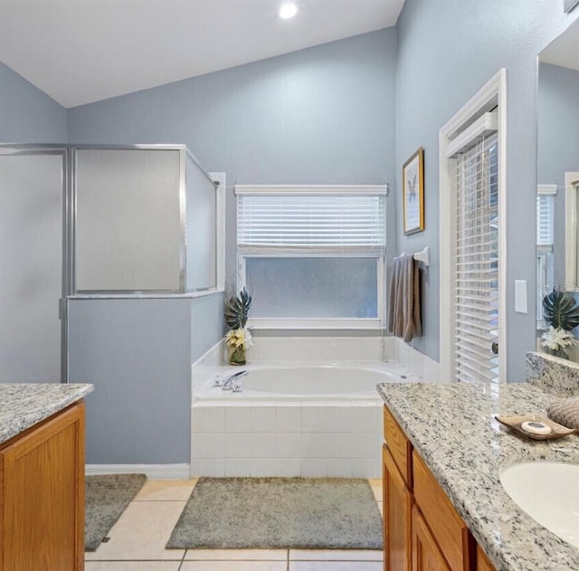 2567 Oneida Loop, Kissimmee, FL 34747 - full bathroom featuring tile patterned flooring, a bath, vanity, and walk in shower