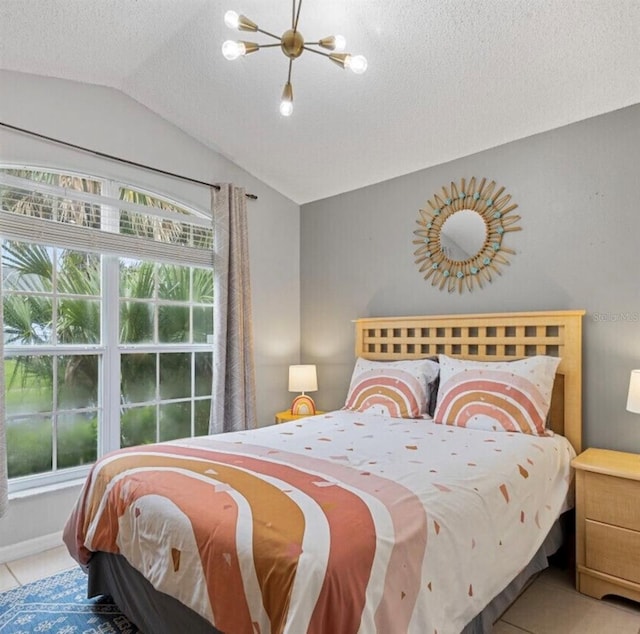 2567 Oneida Loop, Kissimmee, FL 34747 - bedroom featuring vaulted ceiling, a textured ceiling, and tile patterned flooring