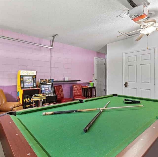 2567 Oneida Loop, Kissimmee, FL 34747 - recreation room with billiards, concrete block wall, a textured ceiling, and ceiling fan