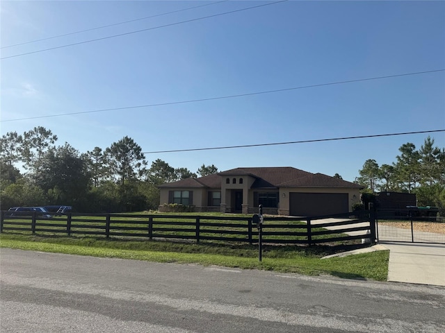 18805 Nettleton St, Orlando, FL 32833 - view of front facade featuring a fenced front yard, an attached garage, and driveway