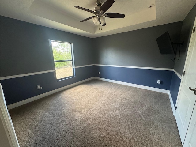 18805 Nettleton St, Orlando, FL 32833 - carpeted empty room featuring a tray ceiling, a ceiling fan, and baseboards