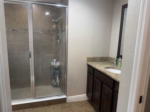 18805 Nettleton St, Orlando, FL 32833 - full bathroom with a shower stall, vanity, tile patterned floors, and baseboards