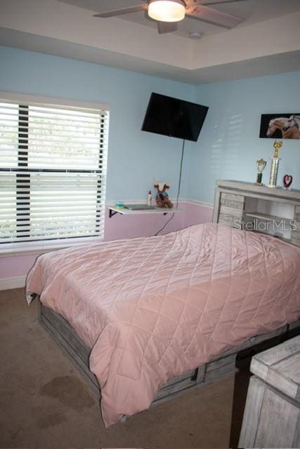 18805 Nettleton St, Orlando, FL 32833 - carpeted bedroom with a ceiling fan