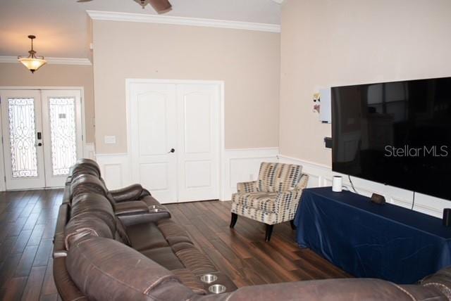 18805 Nettleton St, Orlando, FL 32833 - living room with crown molding, wainscoting, french doors, and wood finished floors