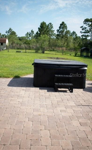 18805 Nettleton St, Orlando, FL 32833 - view of patio / terrace with a hot tub