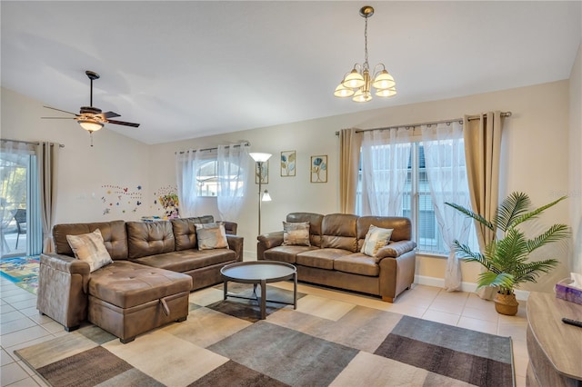 620 Old Bridge Cir, Davenport, FL 33897 - living area featuring vaulted ceiling, a chandelier, light tile patterned floors, healthy amount of natural light, and ceiling fan