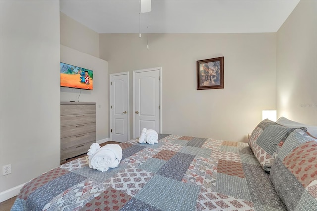 620 Old Bridge Cir, Davenport, FL 33897 - bedroom with vaulted ceiling, baseboards, and a ceiling fan