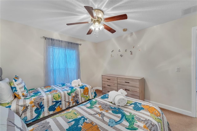 620 Old Bridge Cir, Davenport, FL 33897 - carpeted bedroom with baseboards and ceiling fan