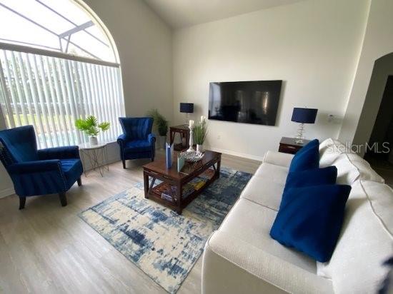 926 Balmoral Dr, Davenport, FL 33896 - living area with wood finished floors and baseboards