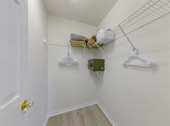 926 Balmoral Dr, Davenport, FL 33896 - spacious closet featuring wood finished floors