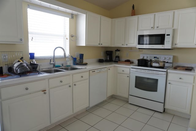 10308 Soaring Eagle Dr, Riverview, FL 33578 - kitchen with white appliances, a sink, white cabinetry, and light countertops