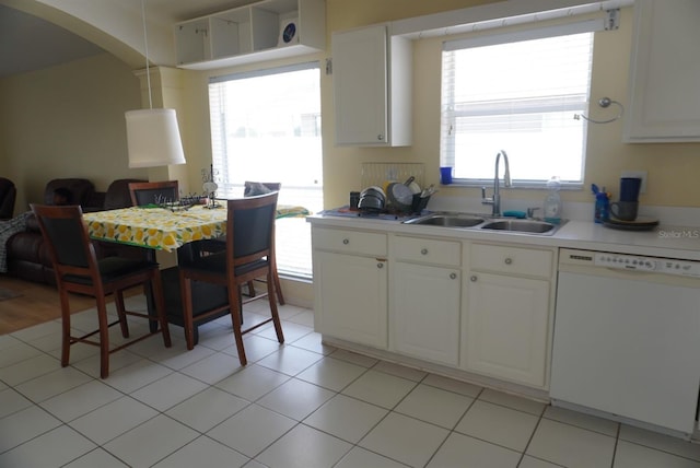 10308 Soaring Eagle Dr, Riverview, FL 33578 - kitchen featuring dishwasher, a sink, light countertops, and plenty of natural light