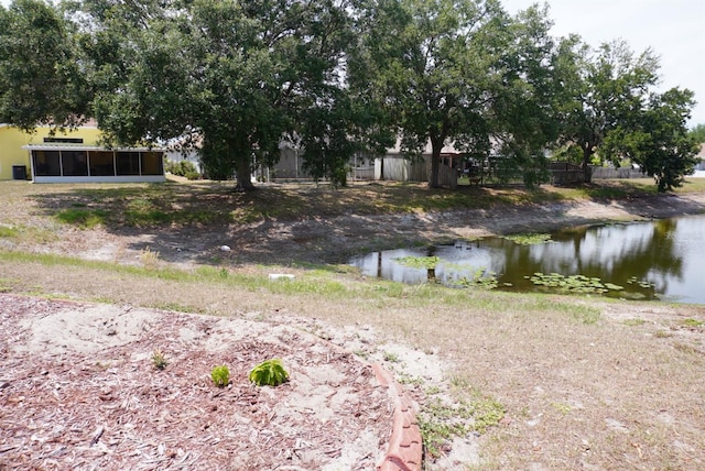 10308 Soaring Eagle Dr, Riverview, FL 33578 - view of yard with a sunroom and a water view