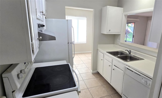 1024 Spring Meadow Dr, Kissimmee, FL 34741 - kitchen featuring white appliances, a sink, light tile patterned floors, and white cabinets