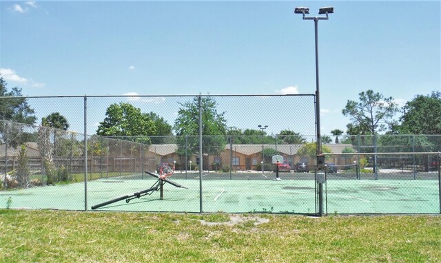 1024 Spring Meadow Dr, Kissimmee, FL 34741 - view of tennis court with fence and community basketball court