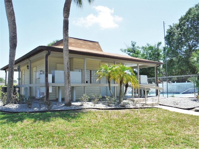 1024 Spring Meadow Dr, Kissimmee, FL 34741 - rear view of house featuring a swimming pool