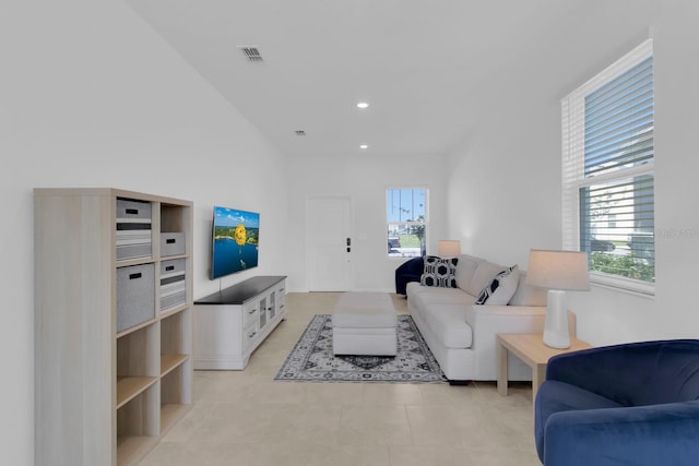 living area featuring healthy amount of natural light, recessed lighting, and light tile patterned floors