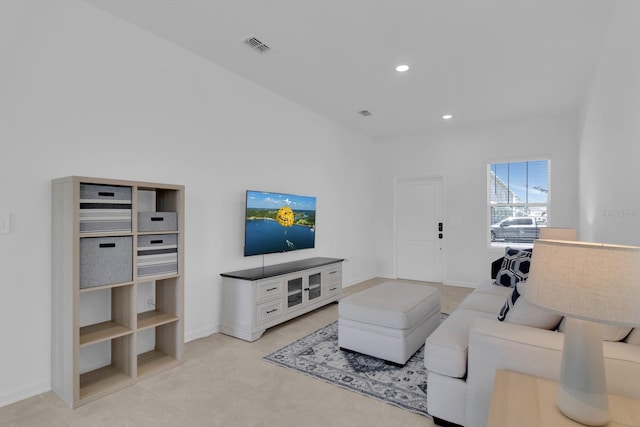living area with recessed lighting and baseboards