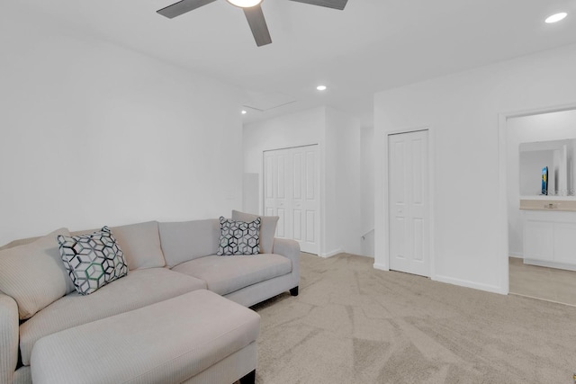living room featuring carpet floors, ceiling fan, recessed lighting, and baseboards
