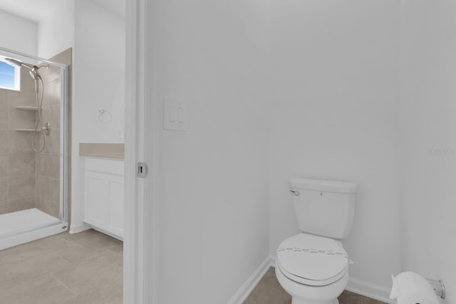 full bathroom with a stall shower, toilet, and tile patterned floors