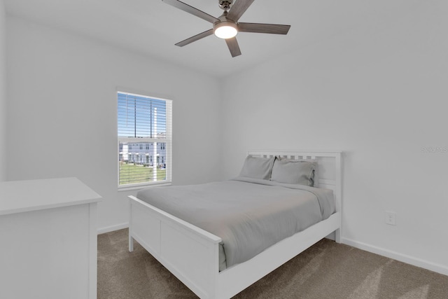 bedroom featuring carpet floors, baseboards, and ceiling fan