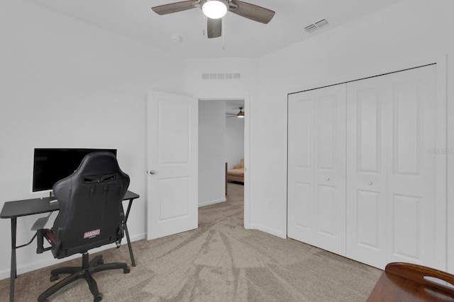 office space featuring ceiling fan, carpet floors, and baseboards