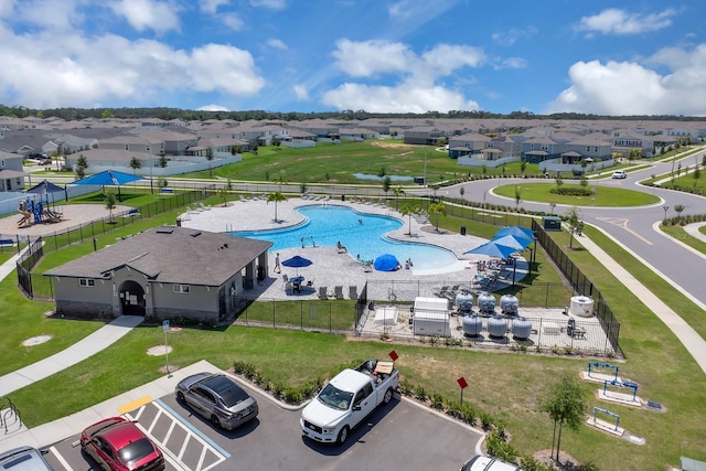aerial view of residential area with a pool