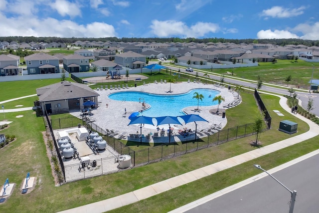 aerial view of residential area with a pool