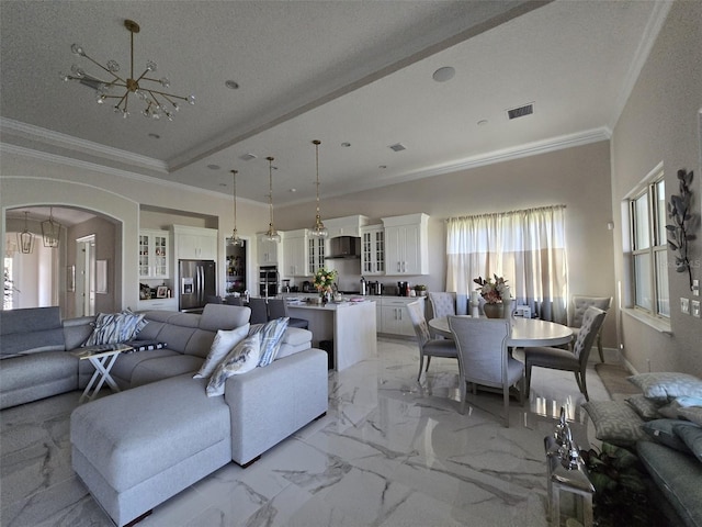 8270 Topsail Pl, Winter Garden, FL 34787 - living area with a chandelier, arched walkways, crown molding, and light marble finish floors