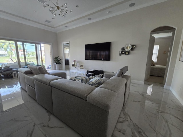 8270 Topsail Pl, Winter Garden, FL 34787 - living area with light marble finish floors, a chandelier, arched walkways, ornamental molding, and a tray ceiling