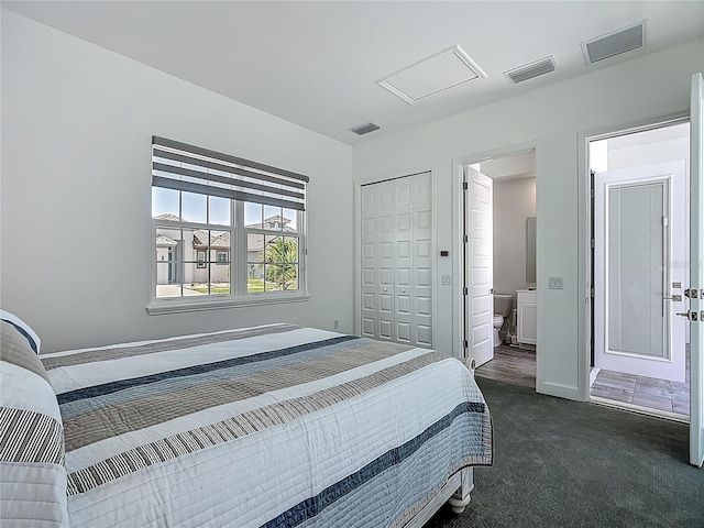 carpeted bedroom with baseboards and a closet
