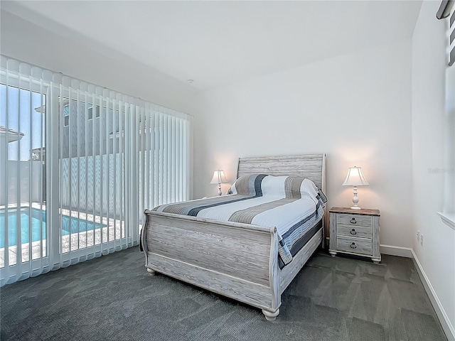 carpeted bedroom featuring multiple windows, access to outside, and baseboards