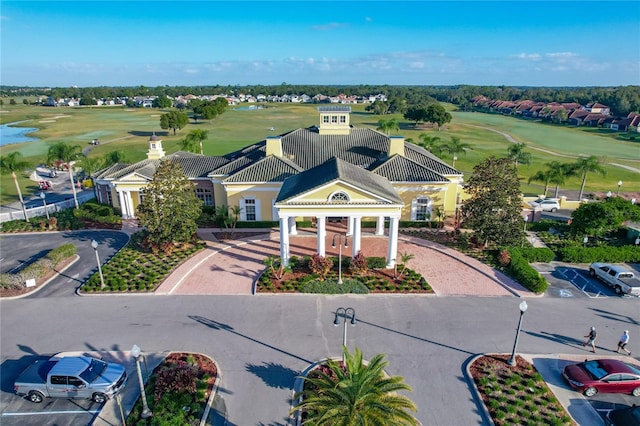 view of subject property with a local golf course
