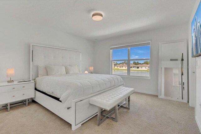 374 Pine Tree Bridge Trl, Saint Cloud, FL 34772 - bedroom with light carpet and baseboards