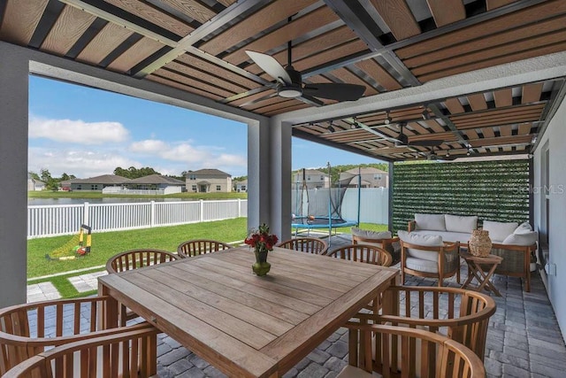 374 Pine Tree Bridge Trl, Saint Cloud, FL 34772 - view of patio / terrace featuring ceiling fan, outdoor dining space, an outdoor living space, a water view, and a residential view