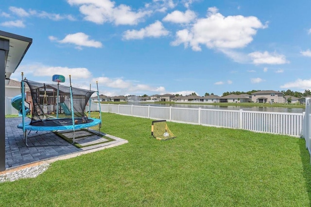 374 Pine Tree Bridge Trl, Saint Cloud, FL 34772 - view of yard with a trampoline, a water view, a patio, and a residential view