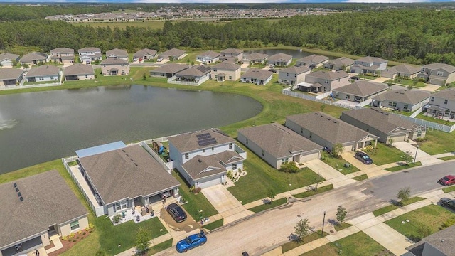 374 Pine Tree Bridge Trl, Saint Cloud, FL 34772 - aerial view of property's location featuring nearby suburban area, a nearby body of water, and a heavily wooded area