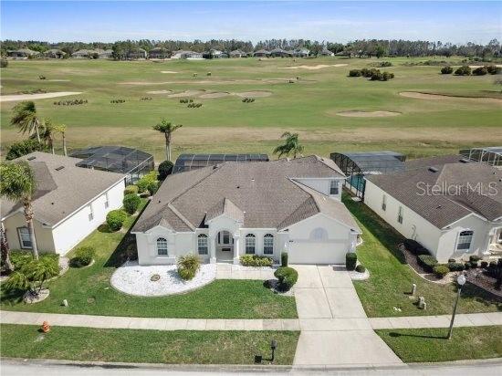 view of subject property featuring a golf club