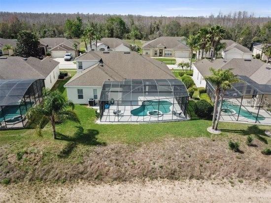 aerial view of residential area featuring a pool