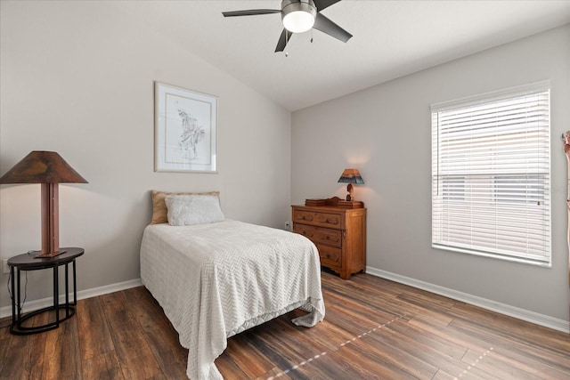 bedroom featuring vaulted ceiling, baseboards, wood finished floors, and ceiling fan
