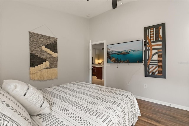 bedroom featuring wood finished floors and baseboards
