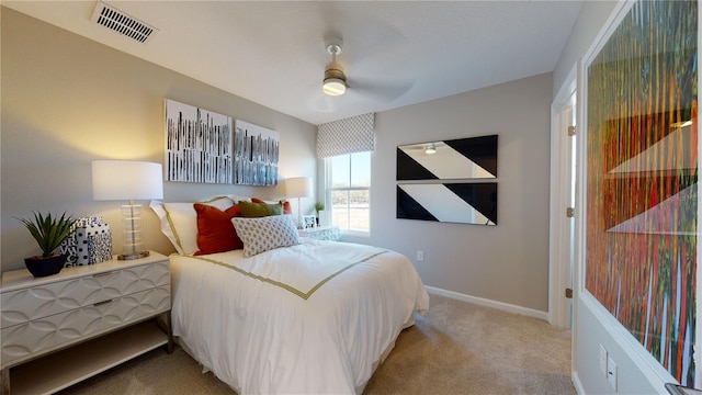 bedroom featuring carpet floors, baseboards, and a ceiling fan