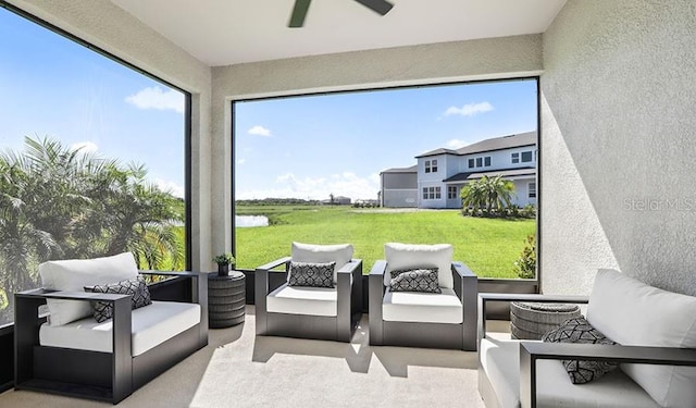 sunroom featuring a textured wall and carpet