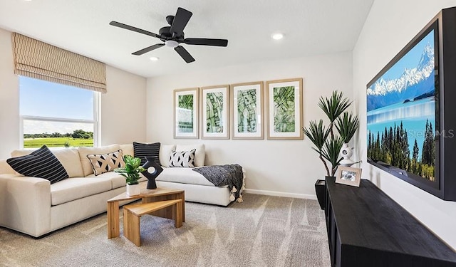living room with light carpet, baseboards, recessed lighting, and ceiling fan