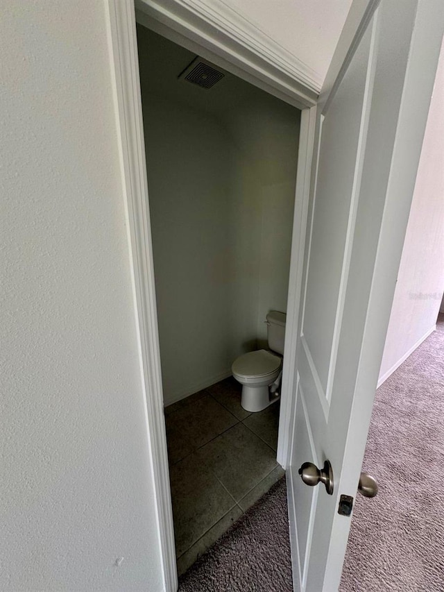 bathroom featuring toilet and tile patterned floors