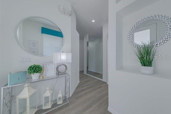 2908 Sunset Lakes Blvd, Kissimmee, FL 34747 - hall featuring wood finished floors and baseboards