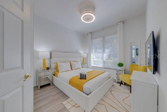 2908 Sunset Lakes Blvd, Kissimmee, FL 34747 - bedroom with light wood finished floors