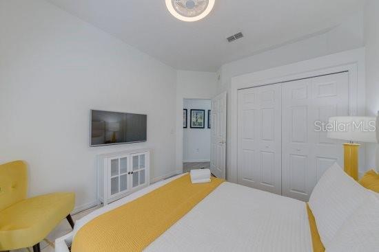 2908 Sunset Lakes Blvd, Kissimmee, FL 34747 - bedroom with a closet and baseboards